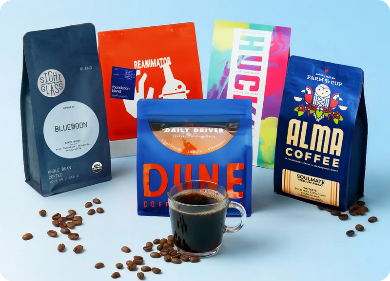 Assorted coffee bags from different brands with a cup of coffee on a light blue background